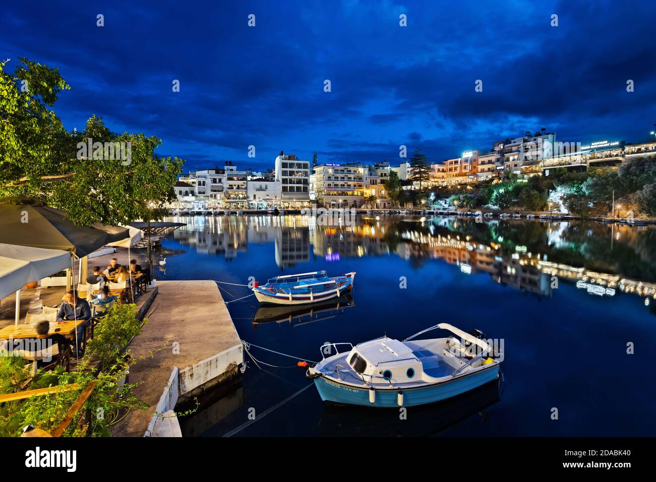 Agios Nikolaos town and the 'bottomless' Voulismeni lake, Lasithi, Crete, Greece. Stock Photo