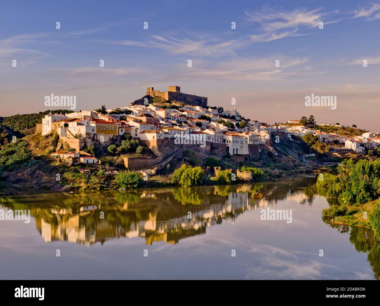 Portugal, the Alentejo,  Mértola, the town and Moorish castle, on the river Guadiana in evening light Stock Photo