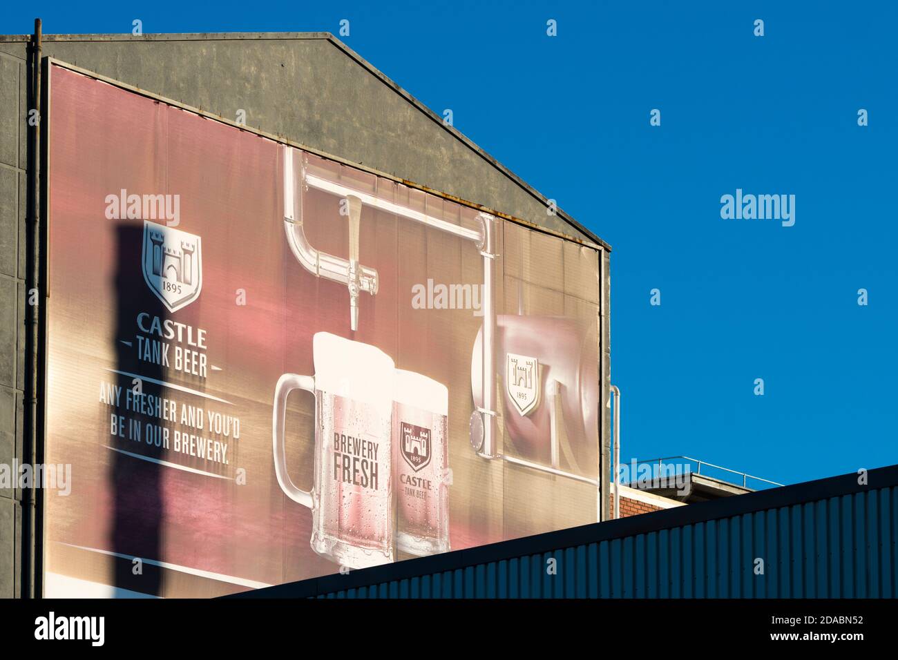 billboard advert, marketing advertisement on a brewery wall for Castle beer in South Africa Stock Photo