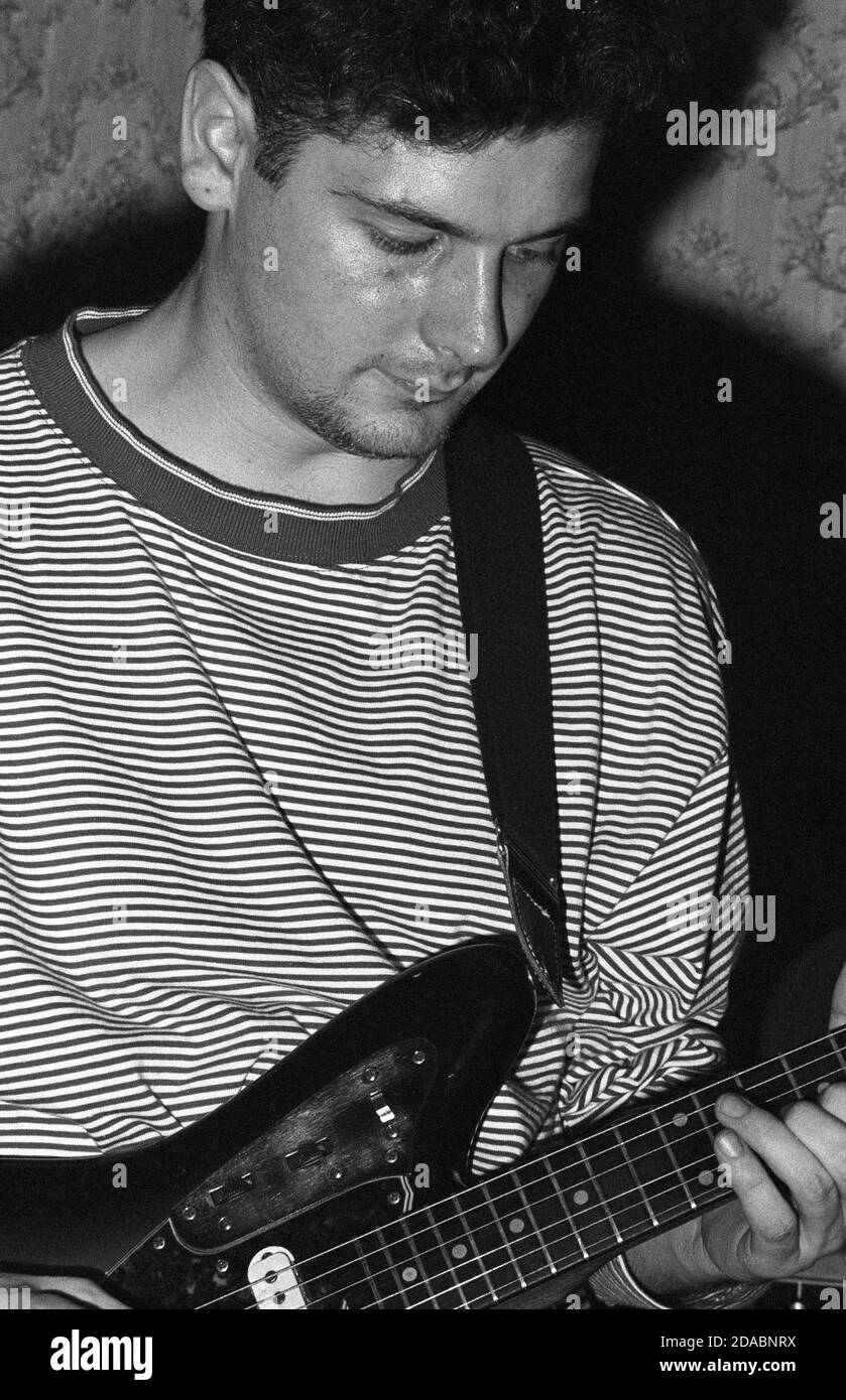 Monochrome image of Gordon Keen of Glasgow indie band BMX Bandits performing at Esquires, Bedford, UK, in 1990. Stock Photo