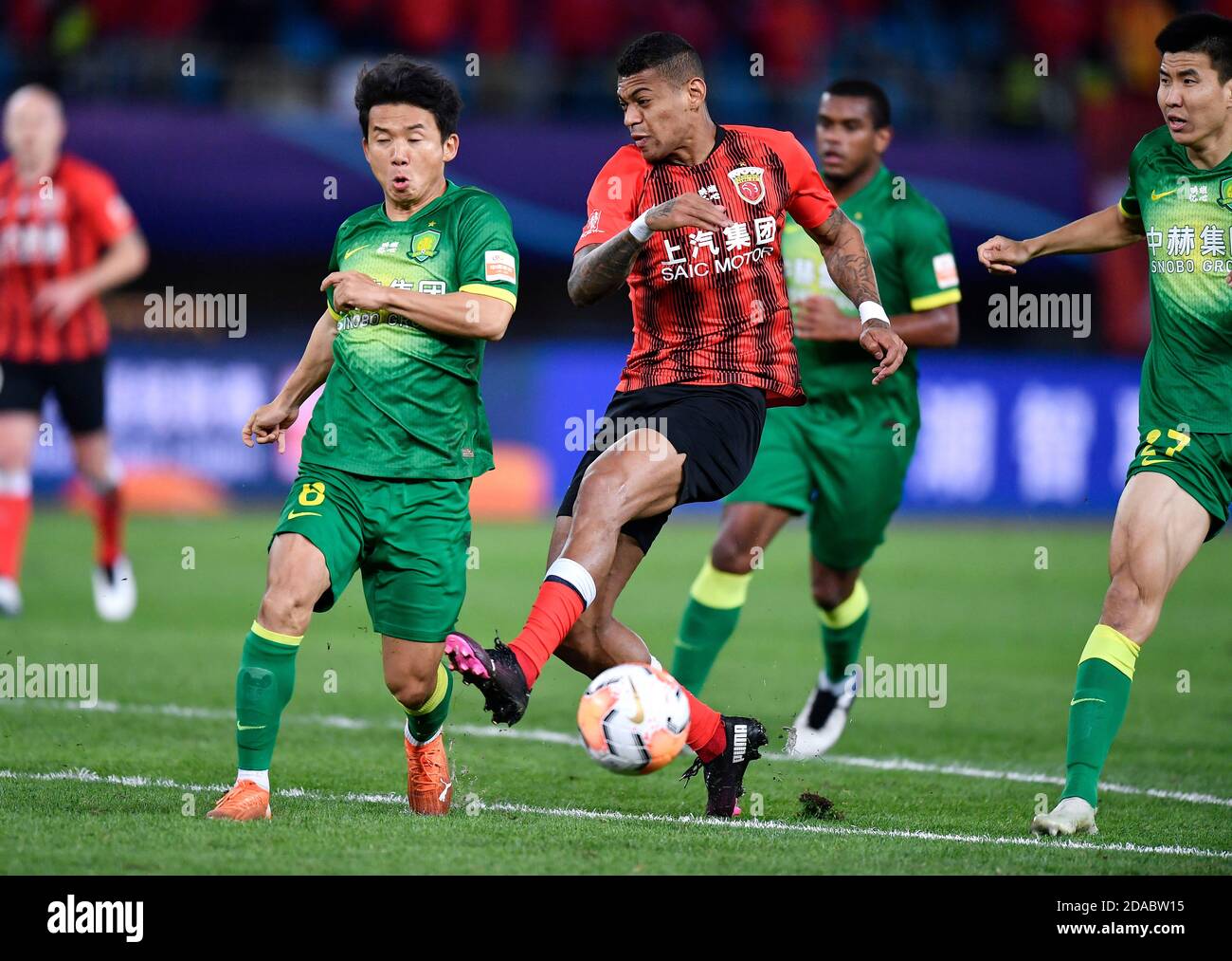 Suzhou, China's Jiangsu Province. 11th Nov, 2020. Ricardo Lopez (3rd R) of Shanghai SIPG shoots during the 20th round match between Beijing Guoan and Shanghai SIPG at 2020 season Chinese Football Association Super League (CSL) Suzhou Division in Suzhou, east China's Jiangsu Province, Nov. 11, 2020. Credit: Xu Chang/Xinhua/Alamy Live News Stock Photo