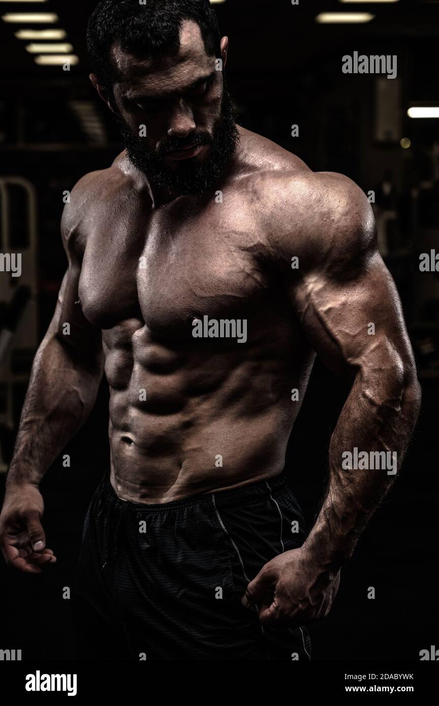 strong sport athlete male with beard and perfect physique body in