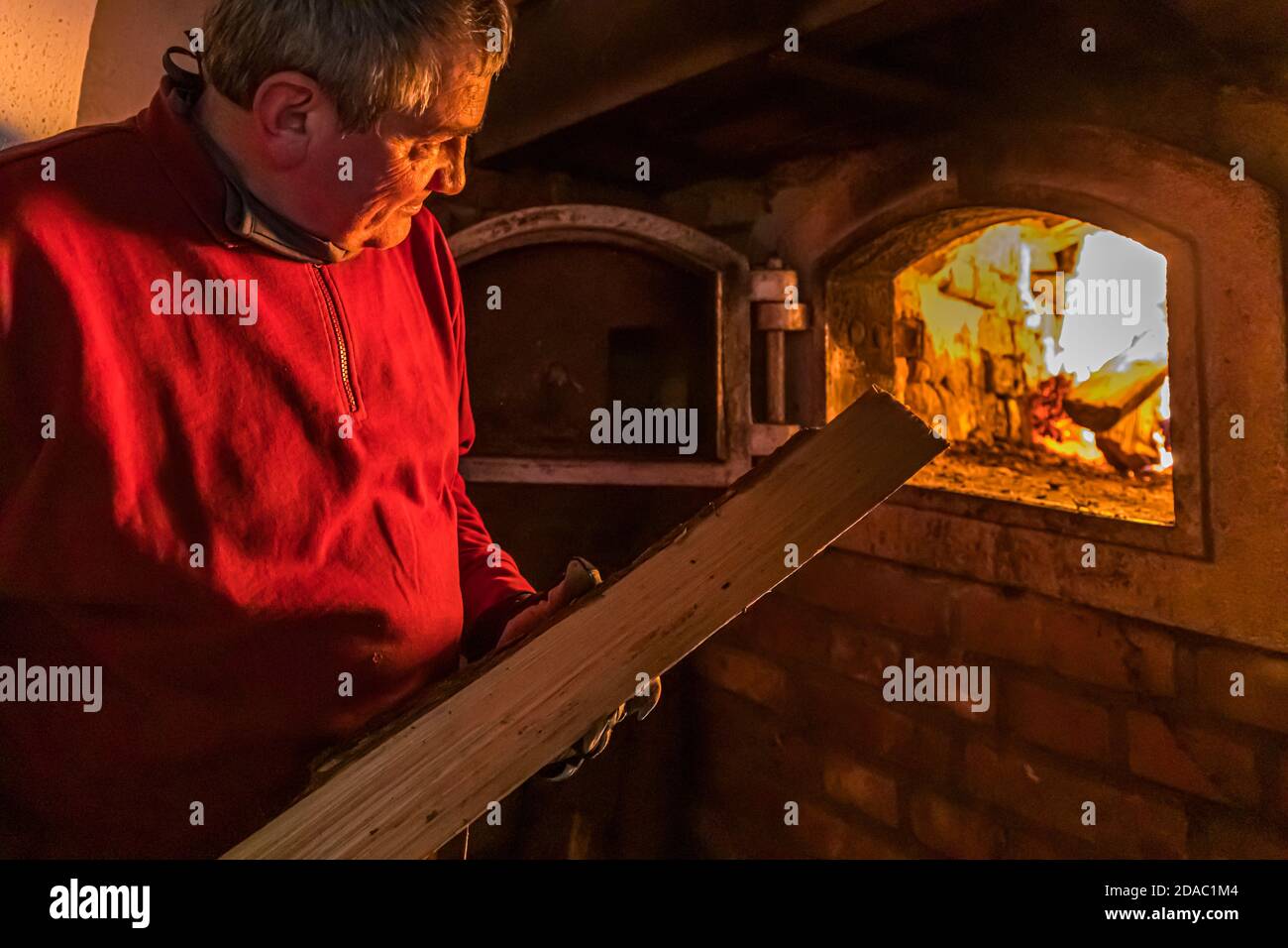 For master brewer Josef (Sepp) Neuber, the day begins with lighting up the two ovens in the old brewery. Traditional Zoigl Brewery in Falkenberg, Germany Stock Photo