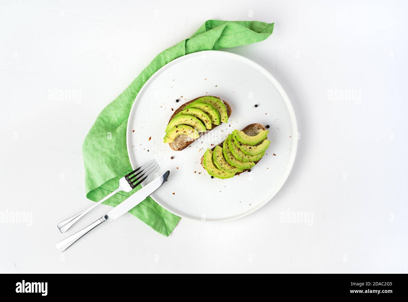 Flat dish with two sandwiches on a light background. Stock Photo