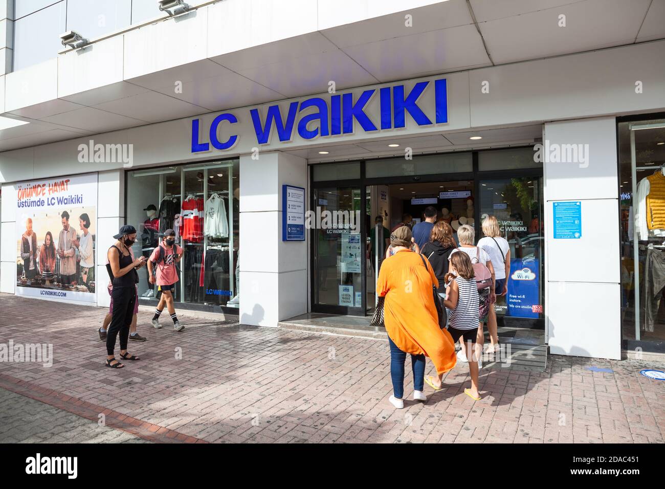Small queue is in LC Waikiki clothes shop due testing for coronavirus such as temperature control. Covid-19 prevention is in entrance of all large sto Stock Photo
