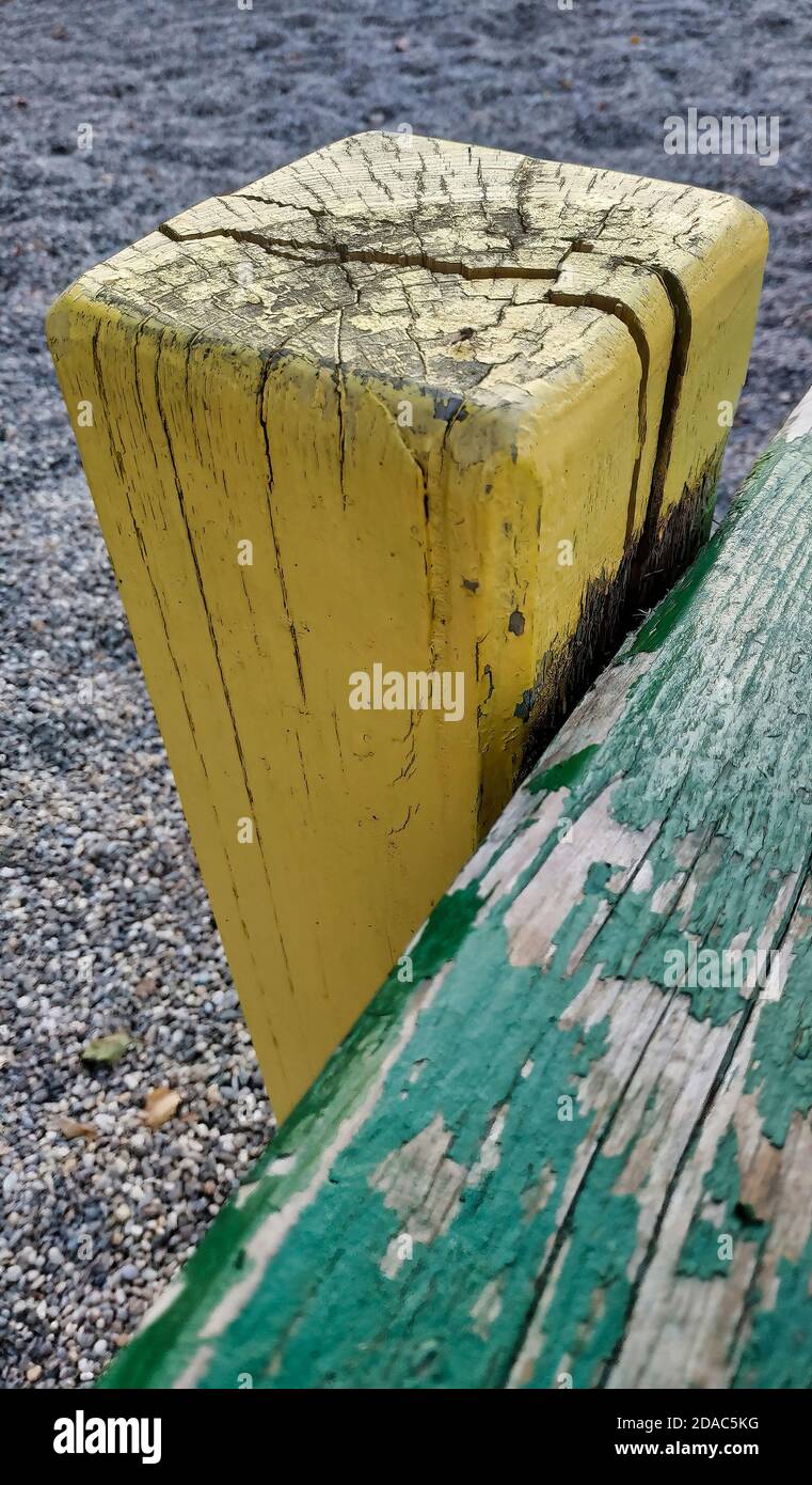 Old wooden seesaw in a playground Stock Photo