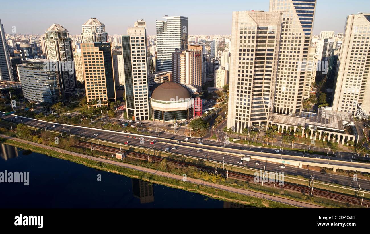 Aerial view of Marginal Pinheiros expressway and Pinheiros river in Sao Paulo city, Brazil. Traffic with few cars near Estaiada Bridge (Ponte Estaiada Stock Photo