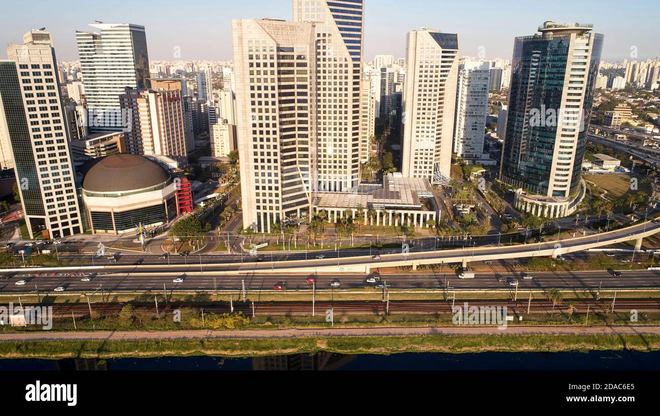 Aerial view of Marginal Pinheiros expressway and Pinheiros river in Sao Paulo city, Brazil. Traffic with few cars near Estaiada Bridge (Ponte Estaiada Stock Photo
