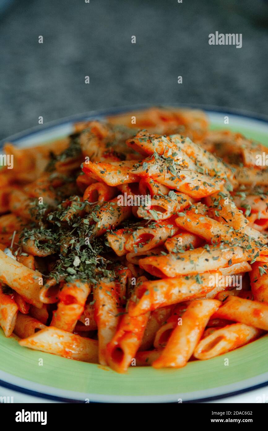 White macaroni with tomato, chilli, oregano, cheese and spices Stock