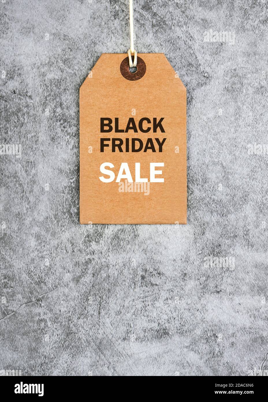 Black friday.Brown sale tag with text on gray background.Shopping concept Stock Photo