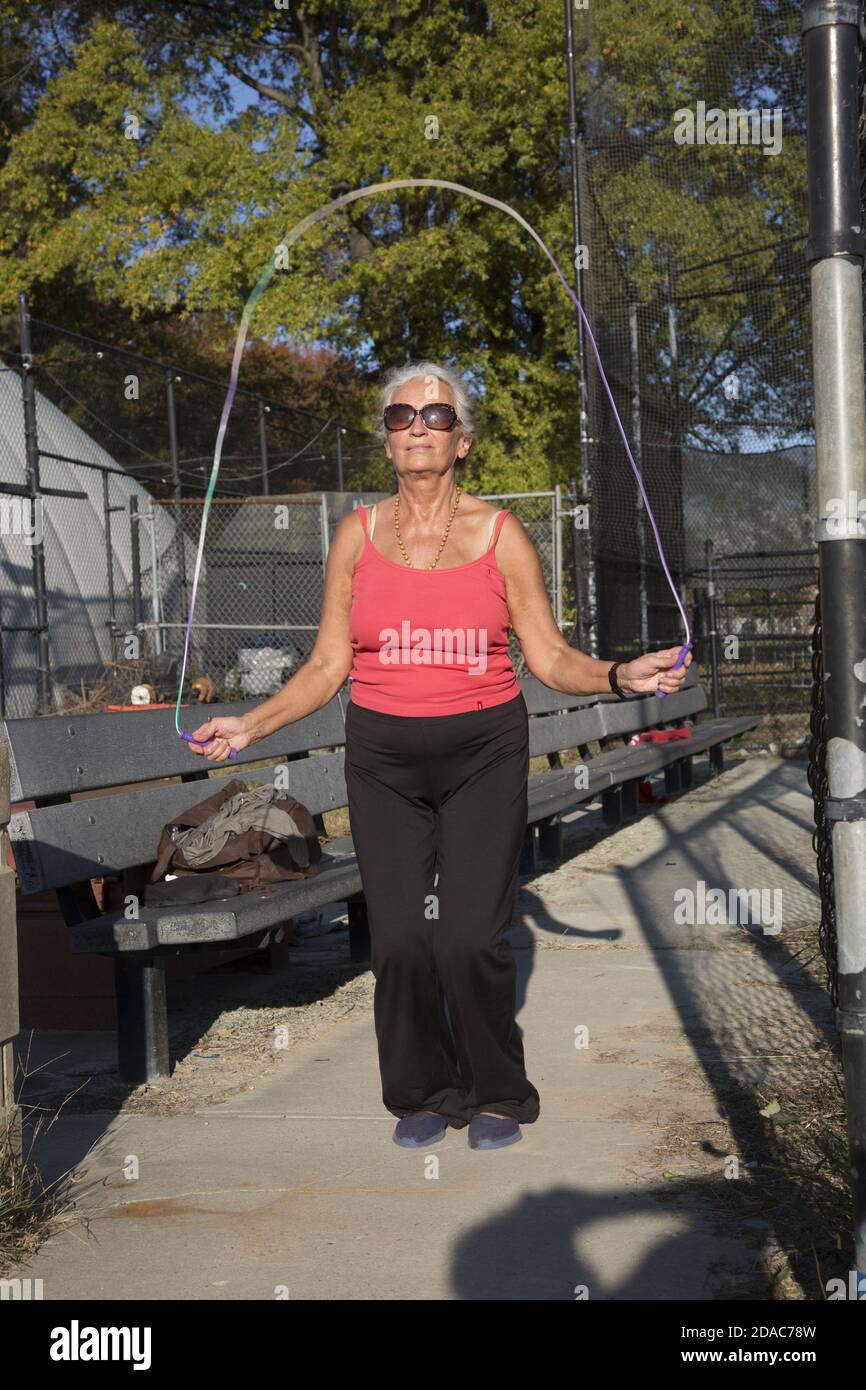https://c8.alamy.com/comp/2DAC78W/70-year-old-woman-stays-in-good-shape-jump-roping-in-the-park-in-brooklyn-new-york-2DAC78W.jpg