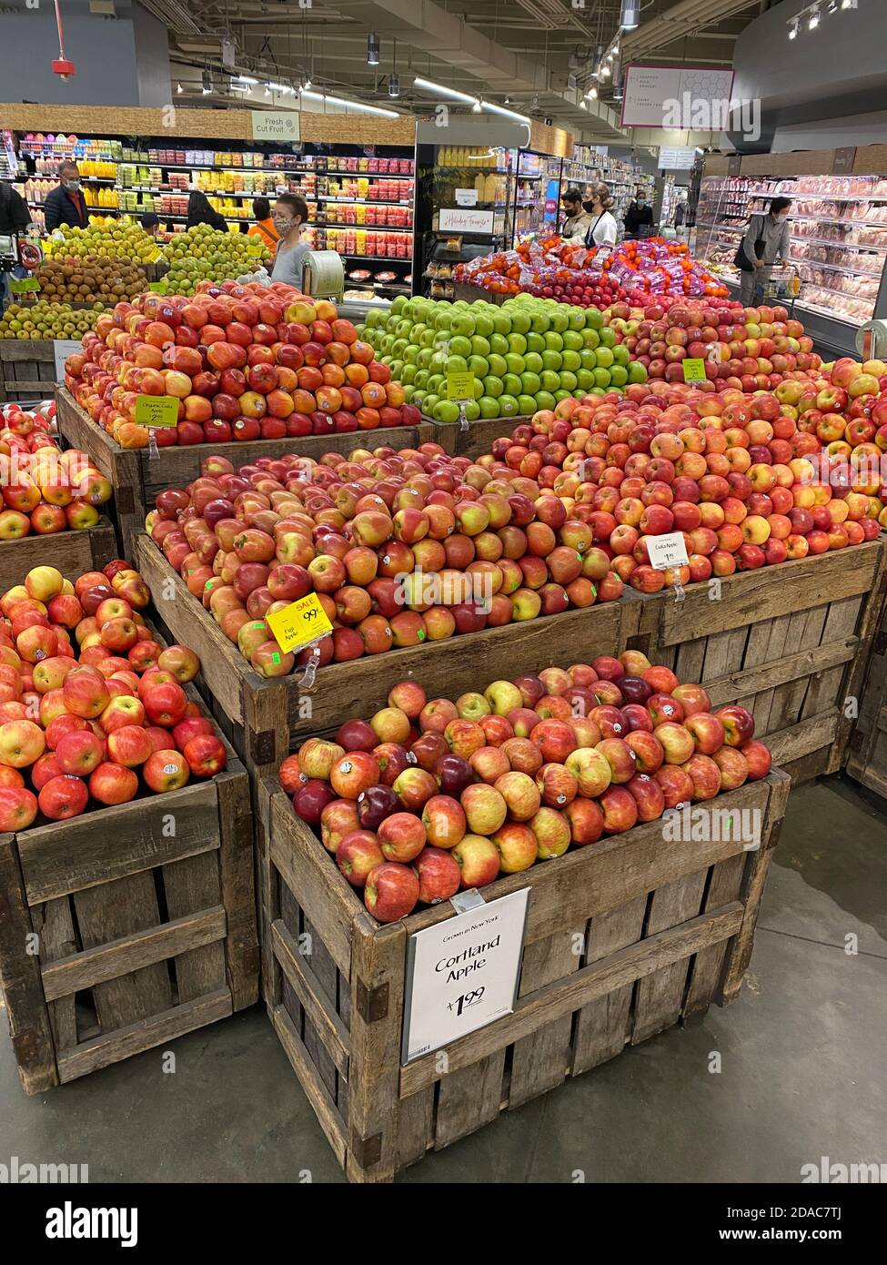 Fresh autumn apples on display by the bushel at Whole Foods Market in Manhattan, New York City. Stock Photo