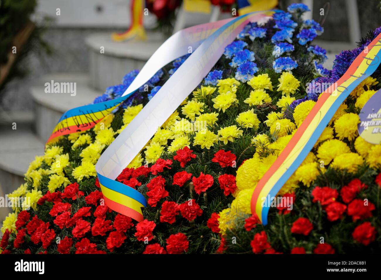 Bucharest, Romania - November 11, 2020: Details with Romanian funeral wreaths at a war memorial monument. Stock Photo