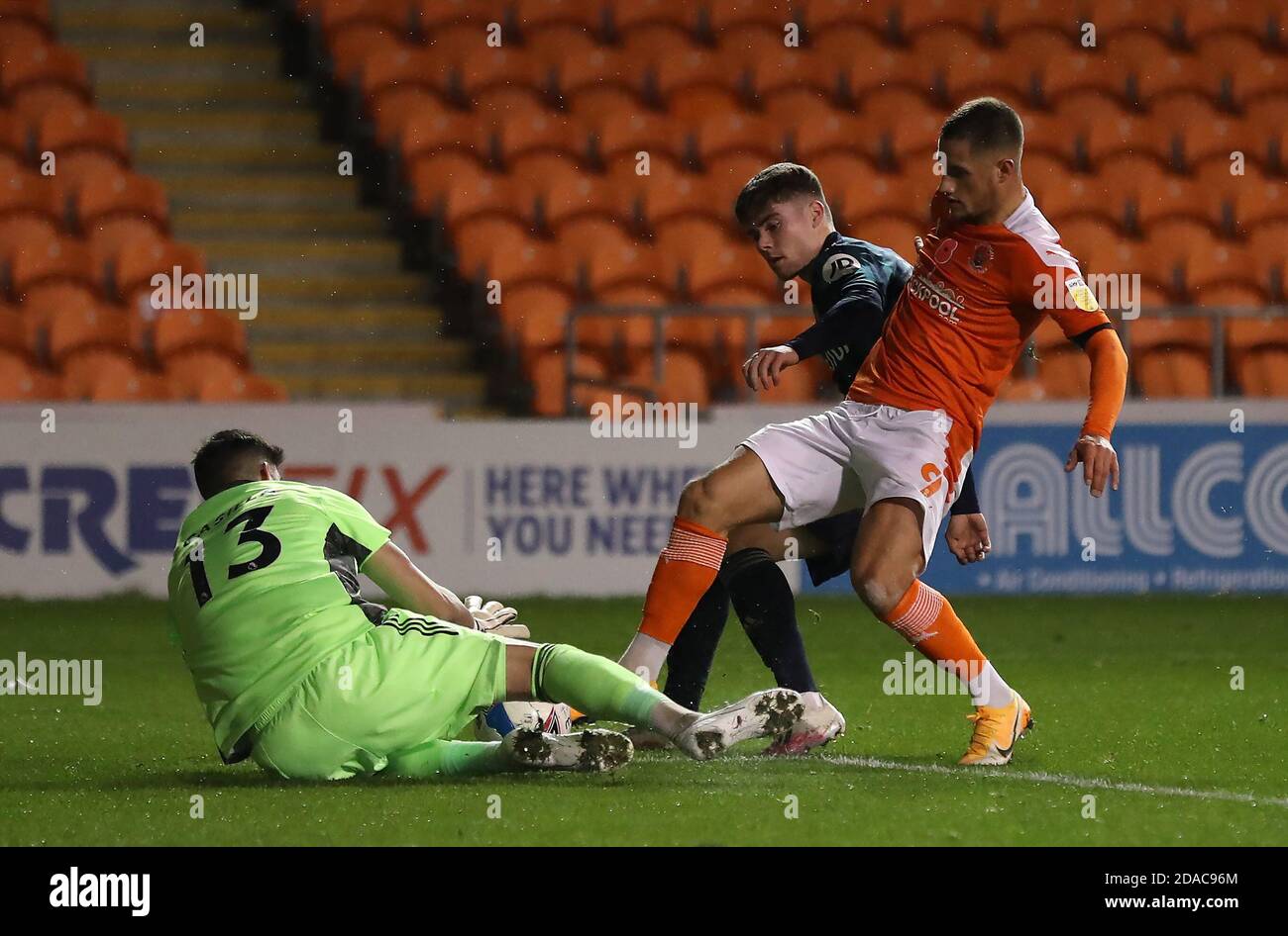Leeds United goalkeeper Kiko Casilla (left) saves at the feet of