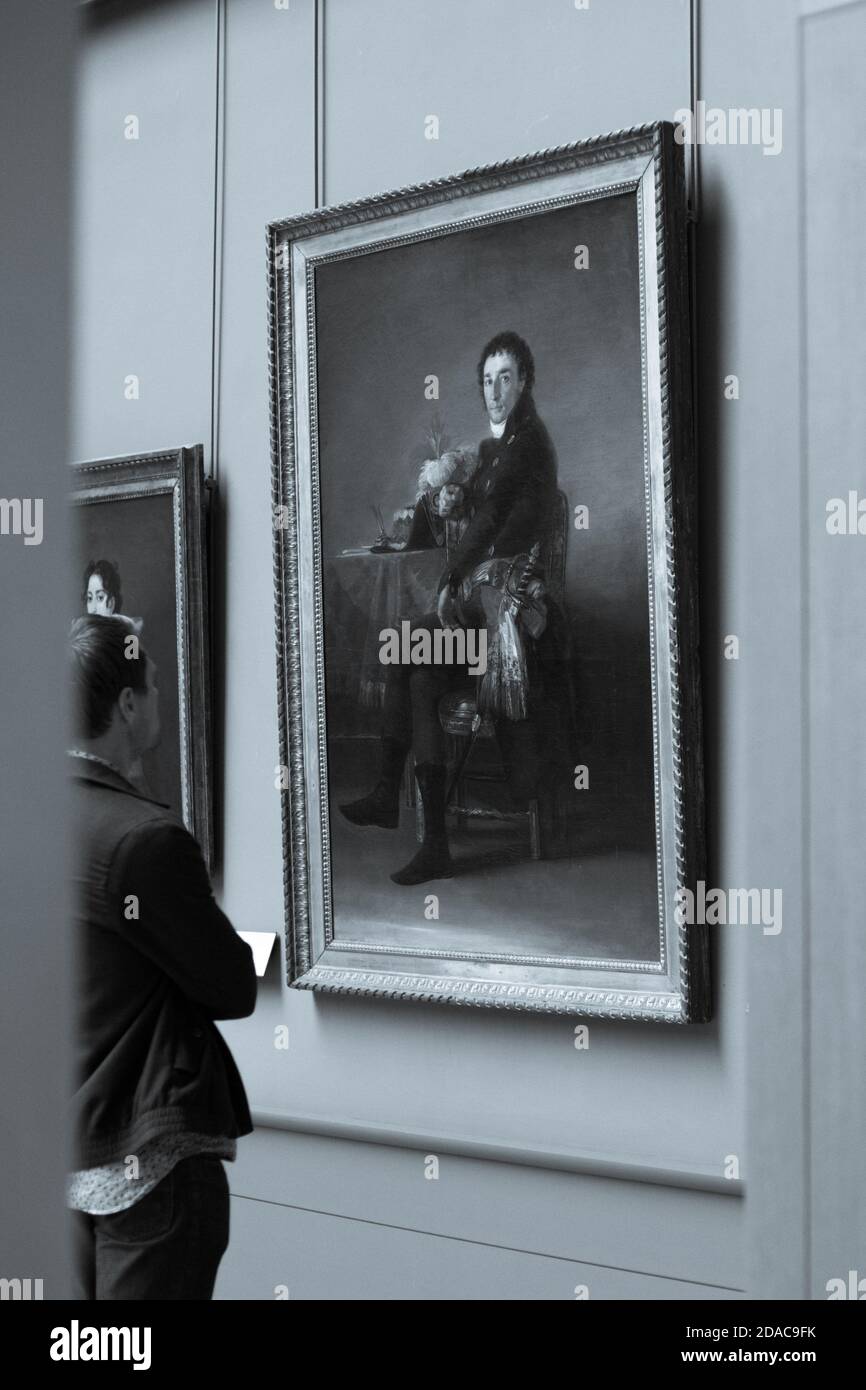 People observing paintings in the Louvre Museum Stock Photo