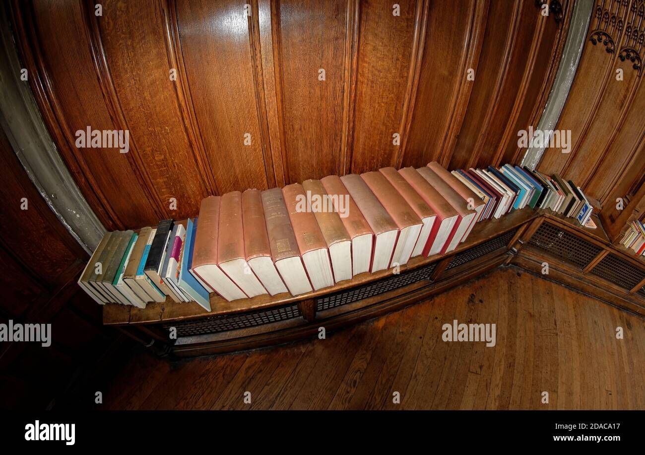 An array of religious and philosophical textbooks within one of the high-ceiling prayer and contemplation  rooms inside Manchester Cathedral (UK). Stock Photo