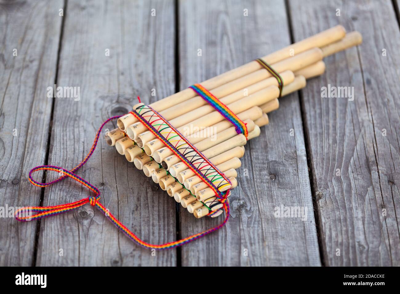 Pan flute (panpipes or syrinx) a musical instrument lying on square-edged  flooring Stock Photo - Alamy