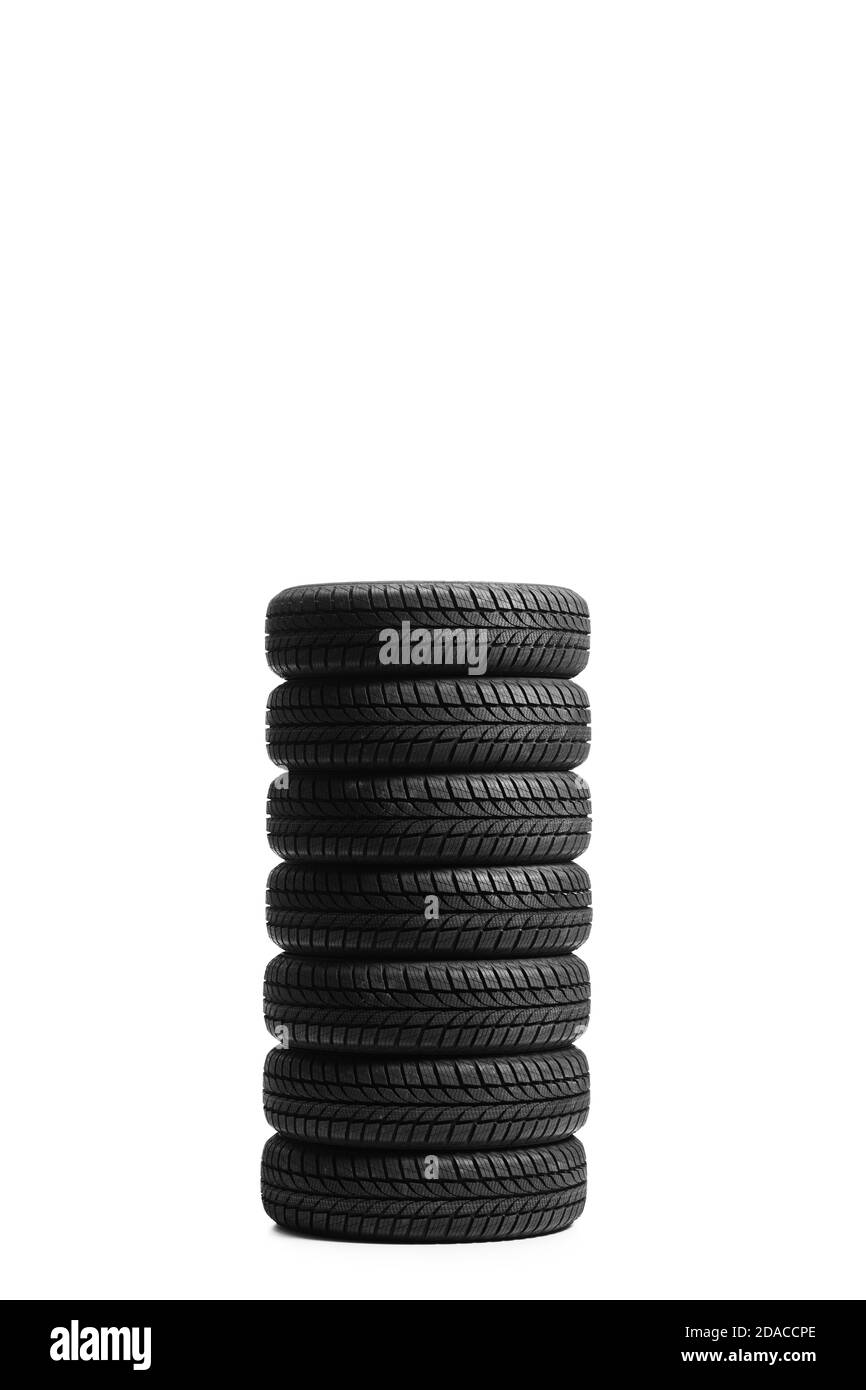 Seven car tires in a pile isolated on white background Stock Photo