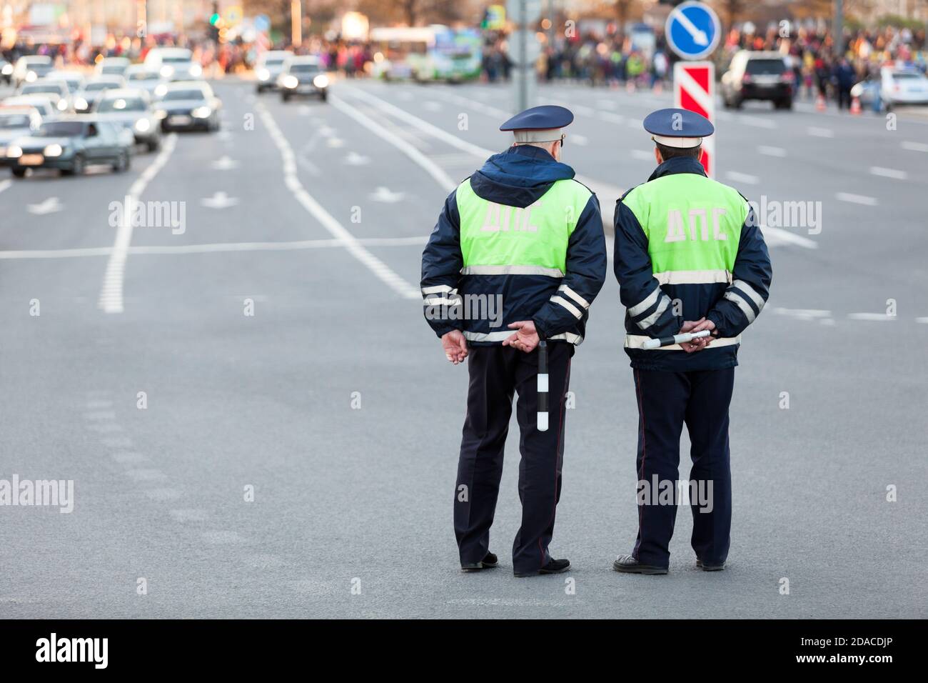 Two officers of traffic control police are on guard at the Victory Day celebration in the World War II. Rear view, full length. The Saint-Petersburg, Stock Photo