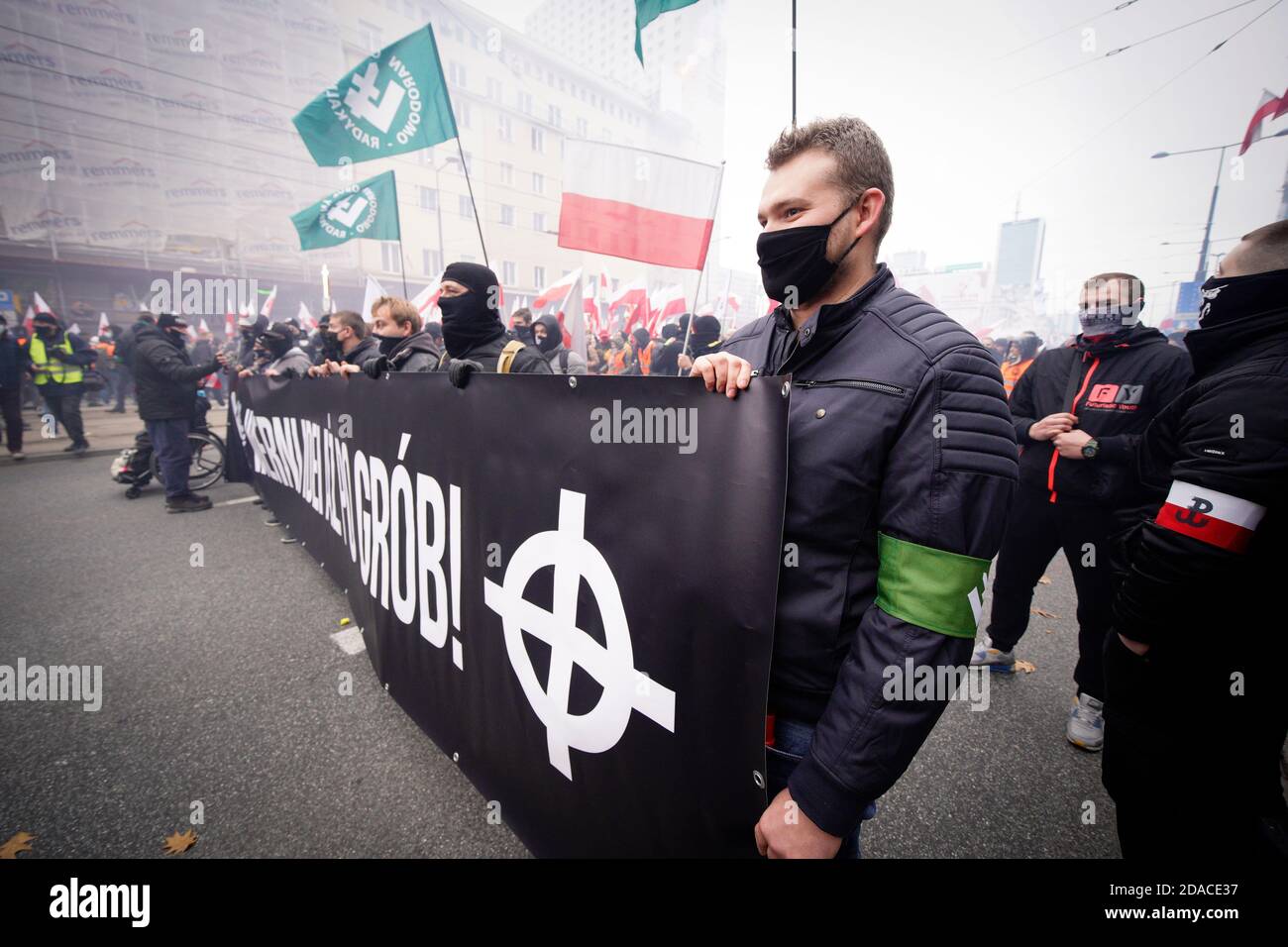 A man holds a banner with the Celtic cross, a white supremacy symbol in  Warsaw, Poland on November 11, 2020. Despite the intention of Independence  Day Stock Photo - Alamy