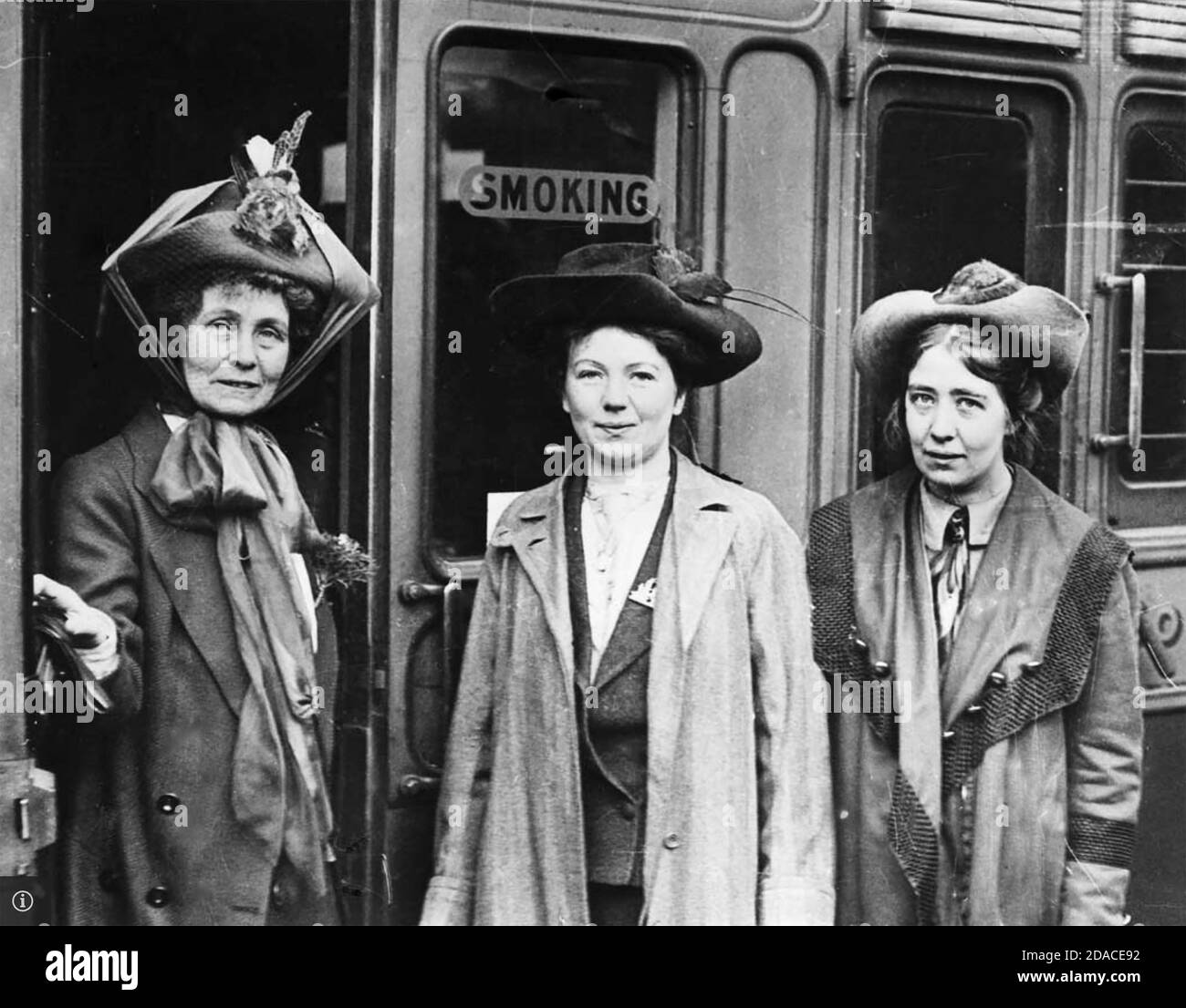 EMMELINE PANKHURST boarding a train at Victoria Station,London, en route to Southampton for a voyage to America in 1909. Seeing her off are two of her daughters, Christabel (centre) and Sylvia. Photo: Bain News Service Stock Photo