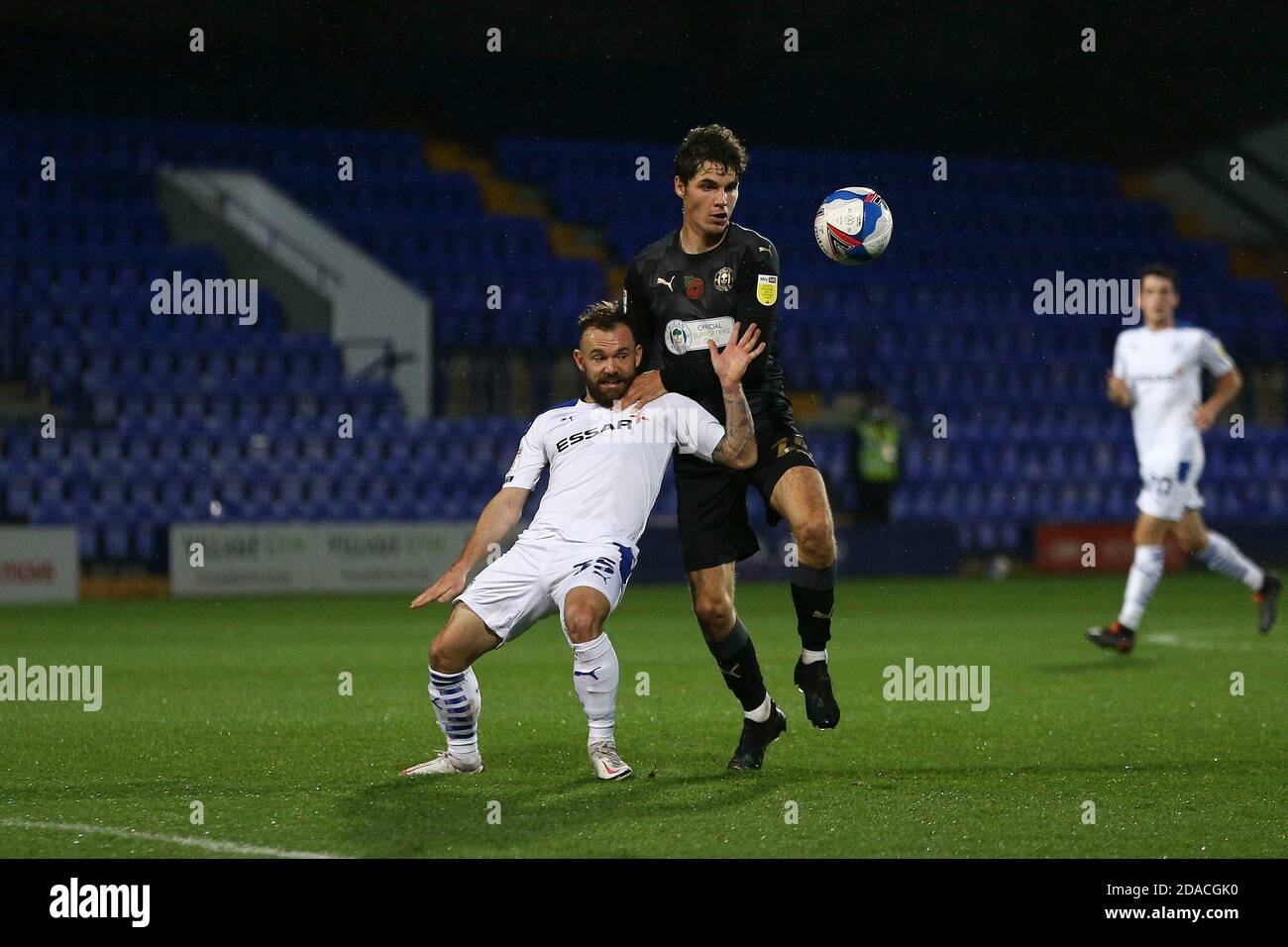 Birkenhead, UK. 11th Nov, 2020. Danny Lloyd of Tranmere Rovers and Alex Perry of Wigan Athletic battle for the ball. The Papa John's Trophy, EFL Trophy, group D match, Tranmere Rovers v Wigan Athletic at Prenton Park, Birkenhead, Wirral on Wednesday 11th November 2020. this image may only be used for Editorial purposes. Editorial use only, license required for commercial use. No use in betting, games or a single club/league/player publications.pic by Chris Stading/Andrew Orchard sports photography/Alamy Live News Credit: Andrew Orchard sports photography/Alamy Live News Stock Photo