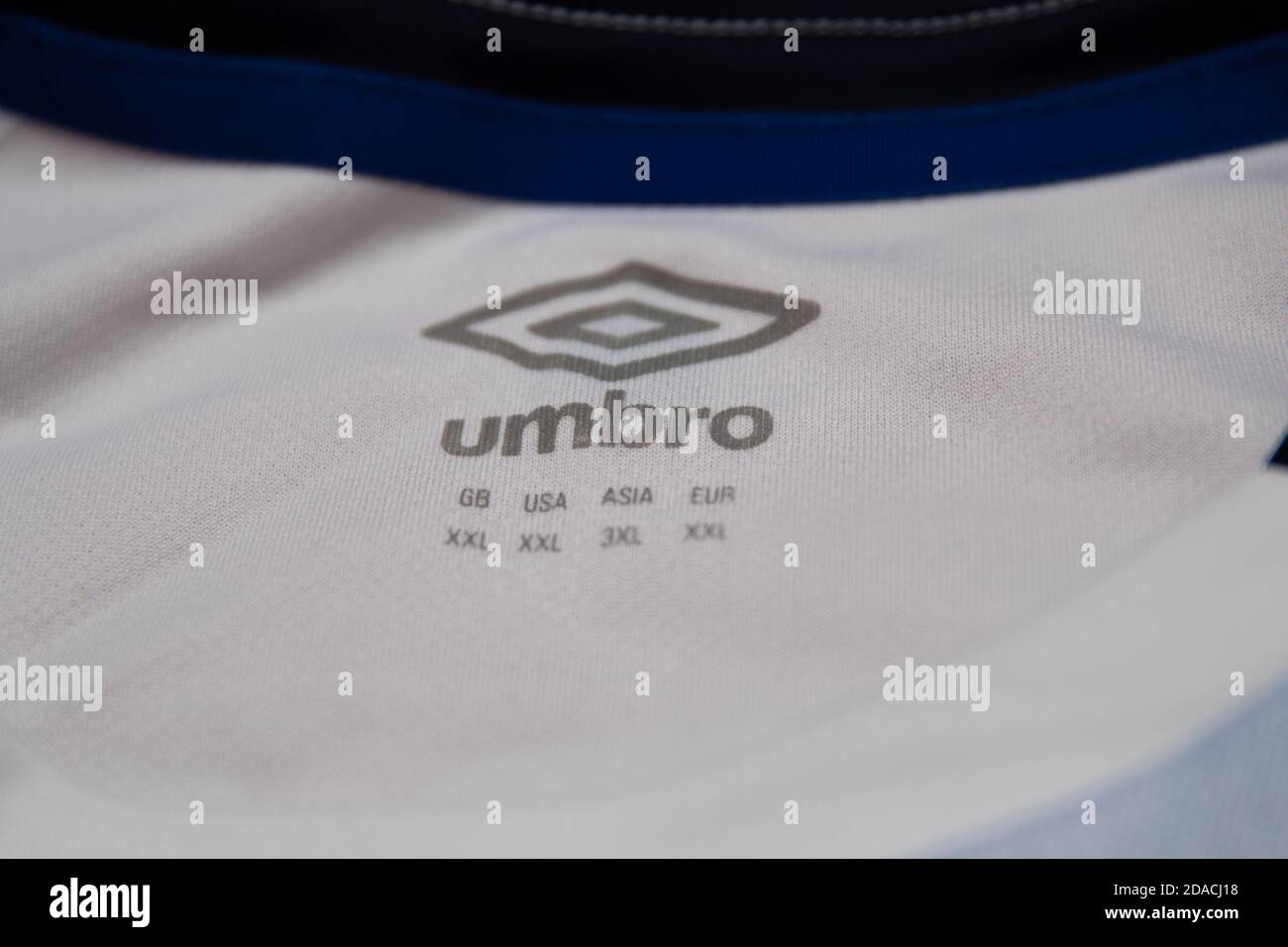 Umbro logo with XXL shirt size inside the shirt collar of a sports football  shirt Stock Photo - Alamy