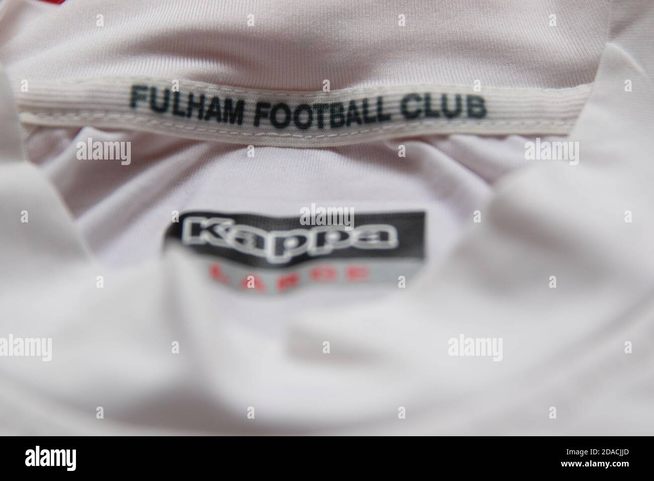 Fulham Football Club in the collar of a white Kappa football shirt Stock Photo