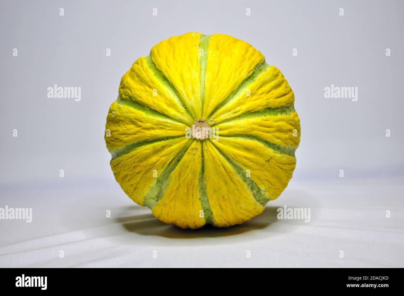 a yellow melon with green stripes Stock Photo Alamy