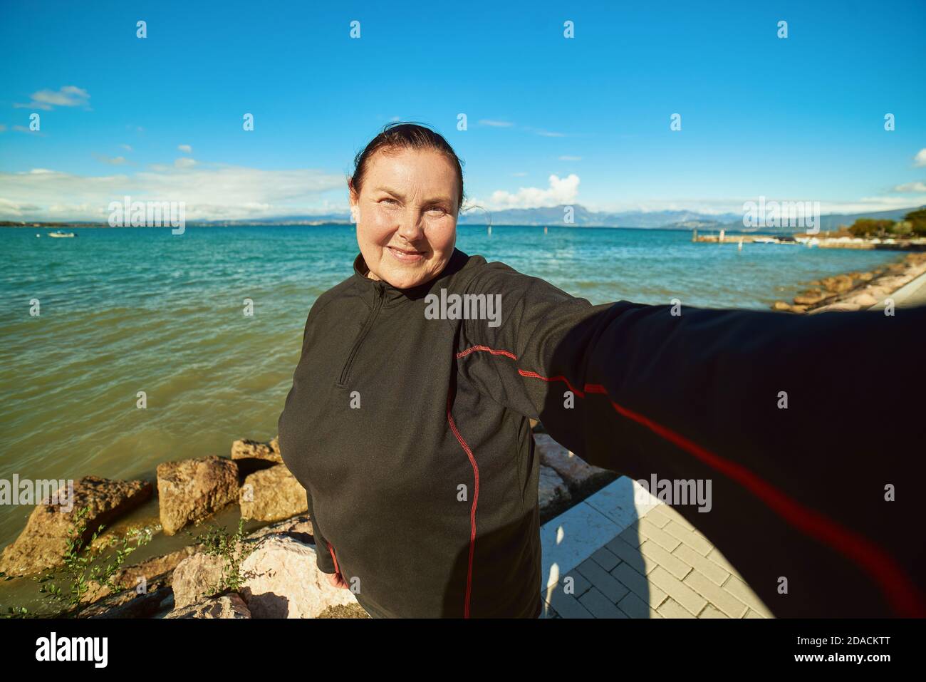 Active senior woman doing selfie outdoors, helthy lifestyle Stock Photo