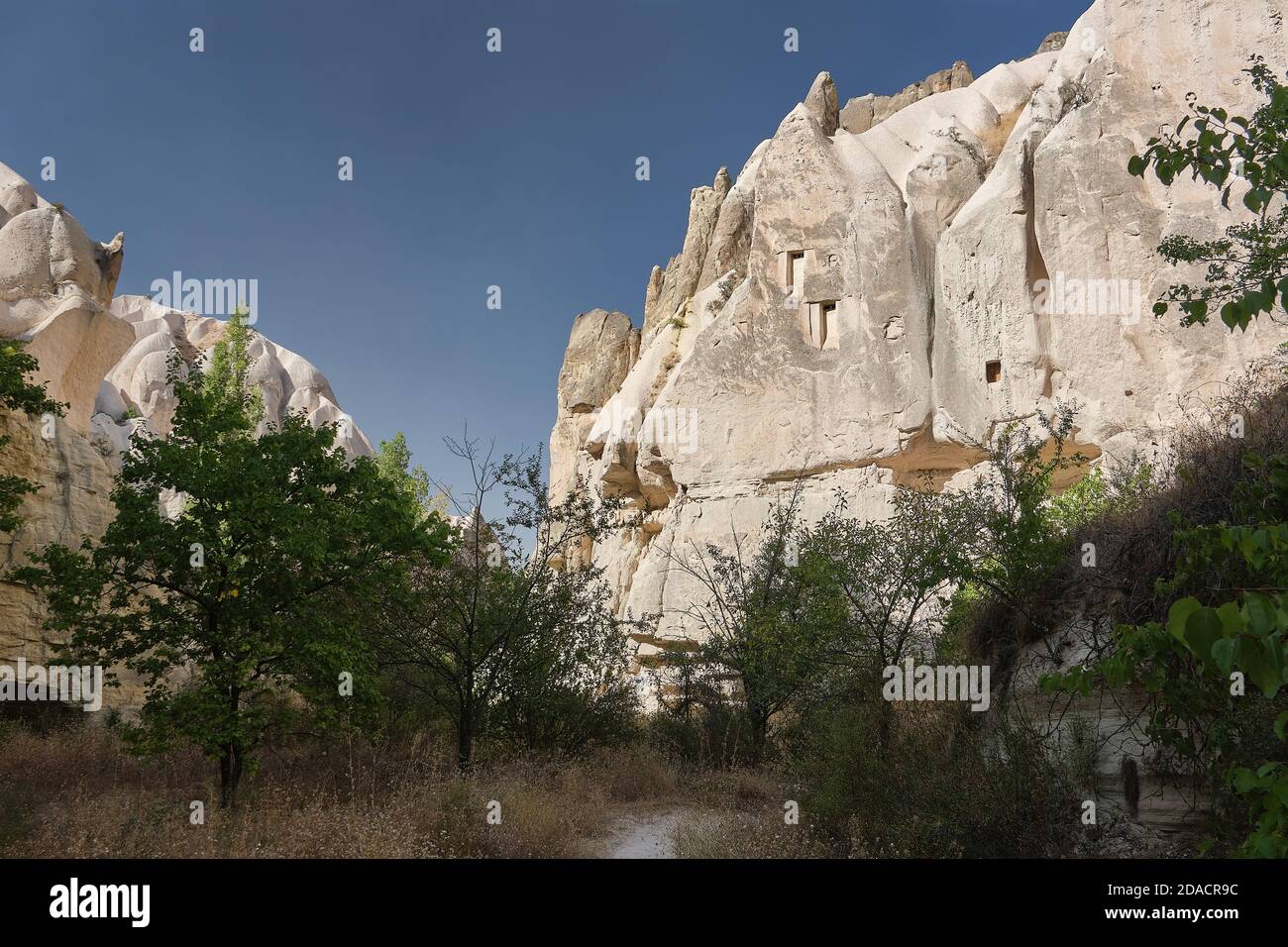 Cappadocia walking trail view of the ruins of fairy chimney shelters built in the rock, Cappadocia, Turkey Stock Photo