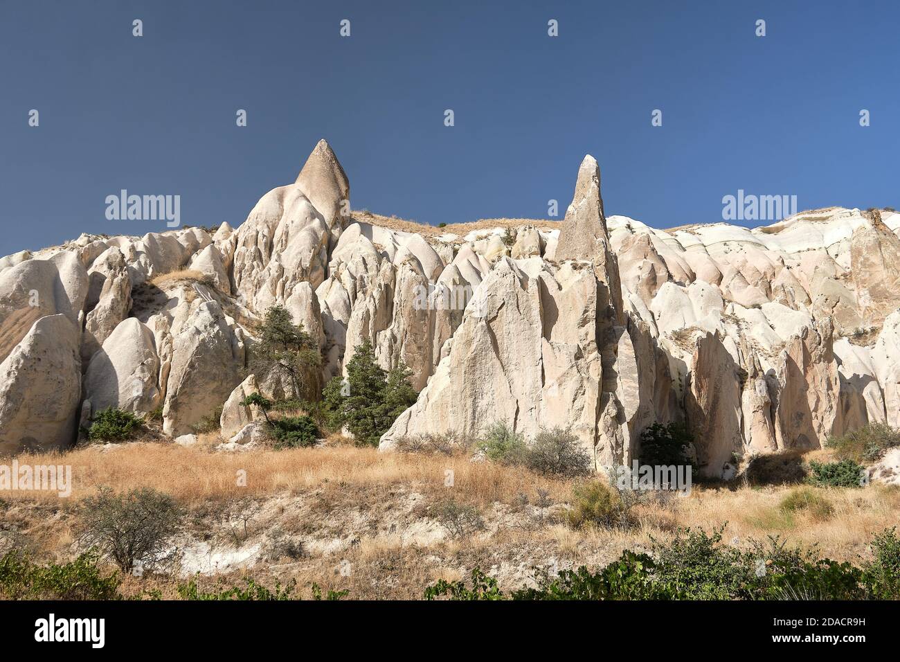 Cappadocia walking trail view of the ruins of fairy chimney shelters built in the rock, Cappadocia, Turkey Stock Photo