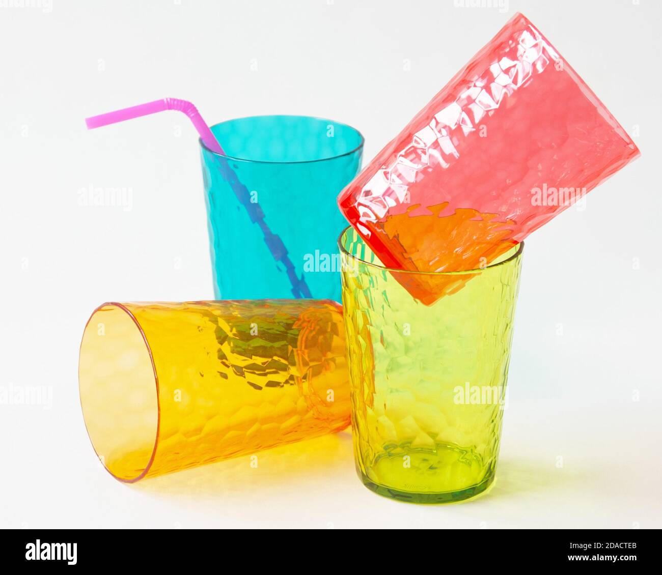 Colorful plastic cups on white background. Stock Photo