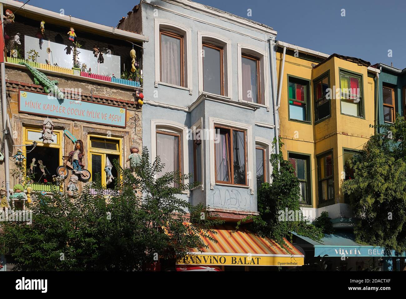 View of a back of a social welfare centre in Balat with toy puppets fixed to the outside walls, Istanbul, Turkey Stock Photo