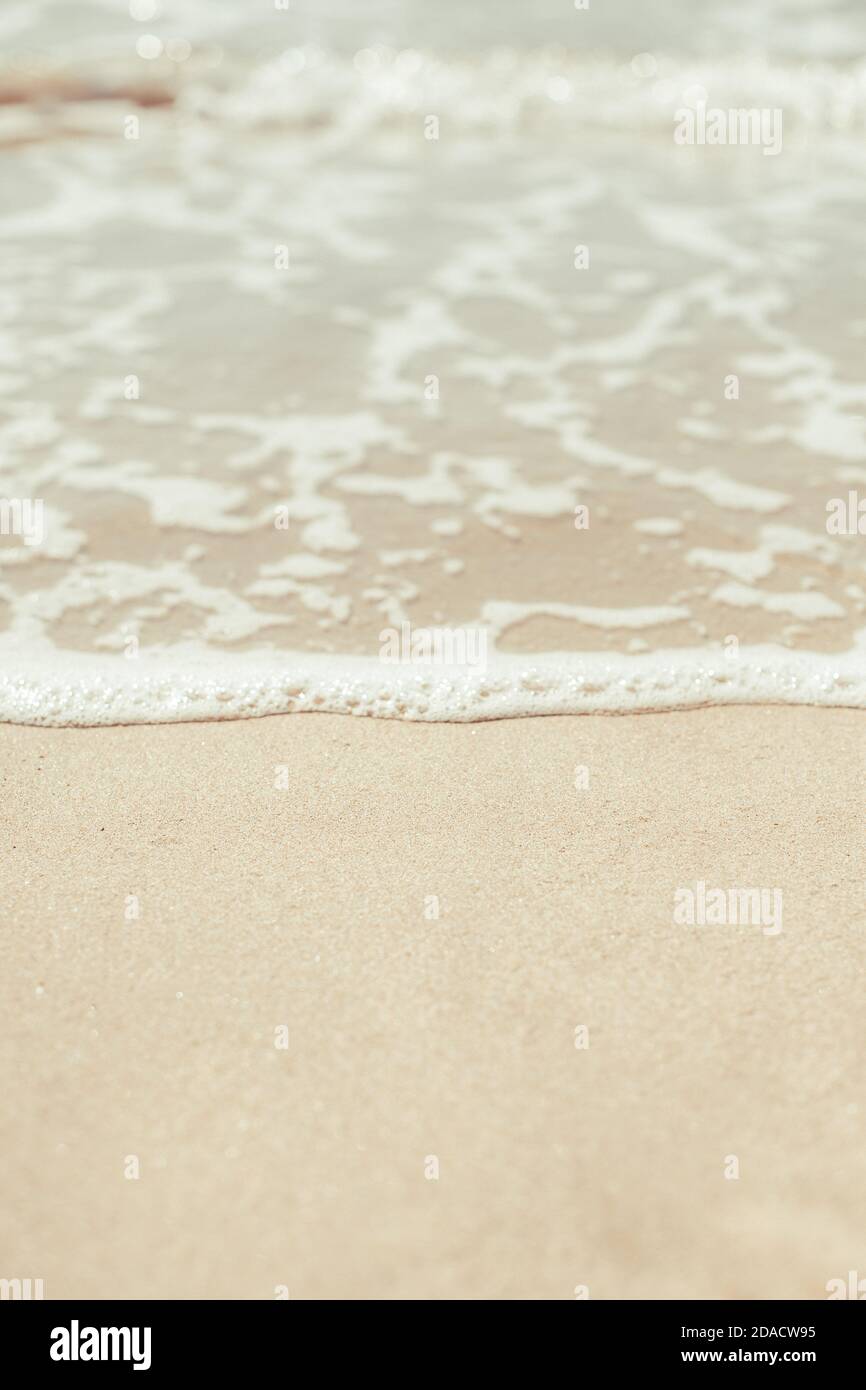 Soft blue ocean wave on sandy beach. Background. Stock Photo