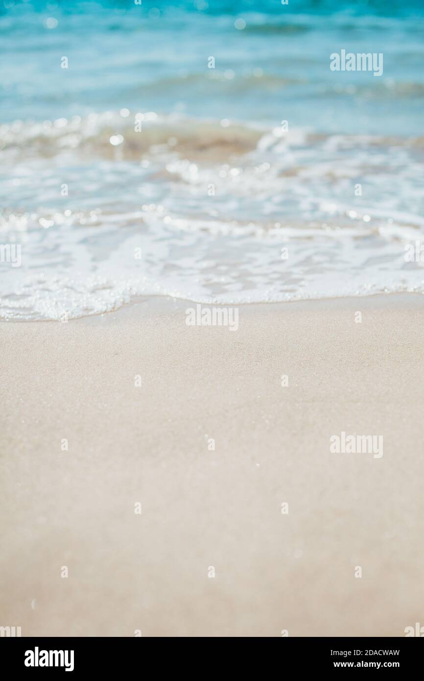 Soft blue ocean wave on sandy beach. Background. Stock Photo