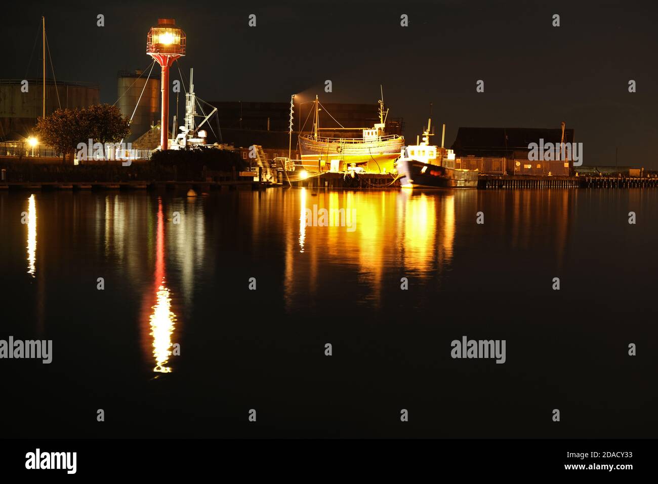 Albatross Light Tower in Arklow harbour with boats in behind Stock Photo