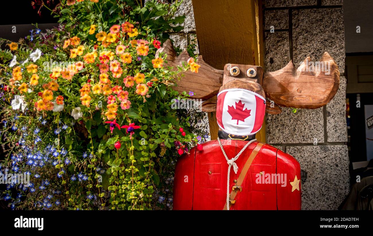 Wooden Statue of a Moose in a Mountie Uniform with a Canadian Maple
