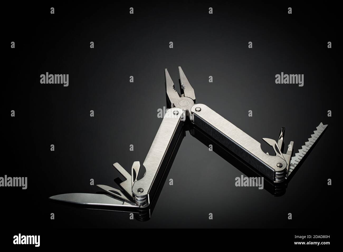 One multipurpose folding knife isolated on black background