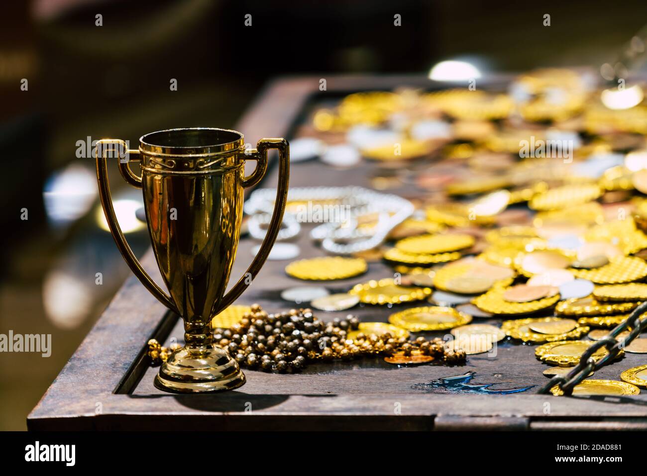 Antique treasure gold trophy with coins for wealth , luxury and success concept Stock Photo