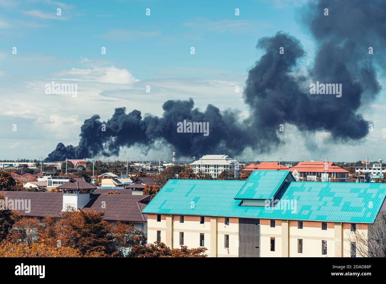 Black smoke from fire burning in residential area Stock Photo Alamy