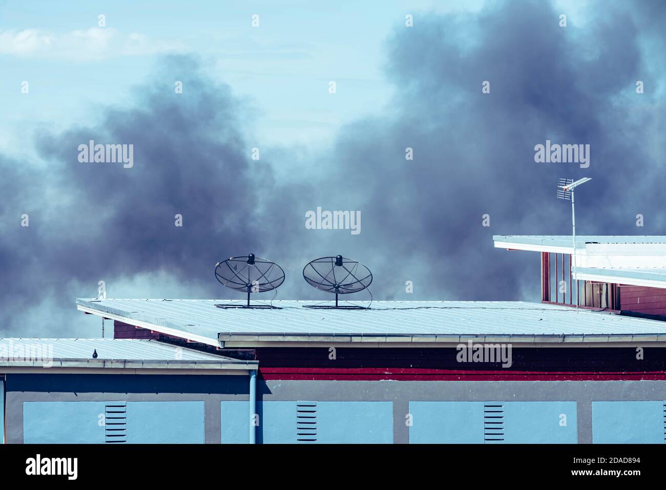 Black smoke from fire burning in residential area Stock Photo Alamy