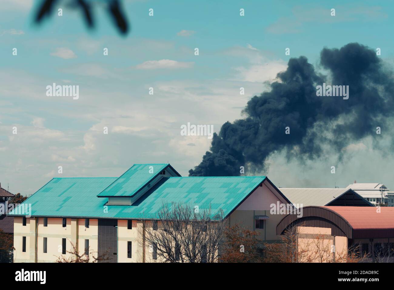 Black smoke from fire burning in residential area Stock Photo Alamy