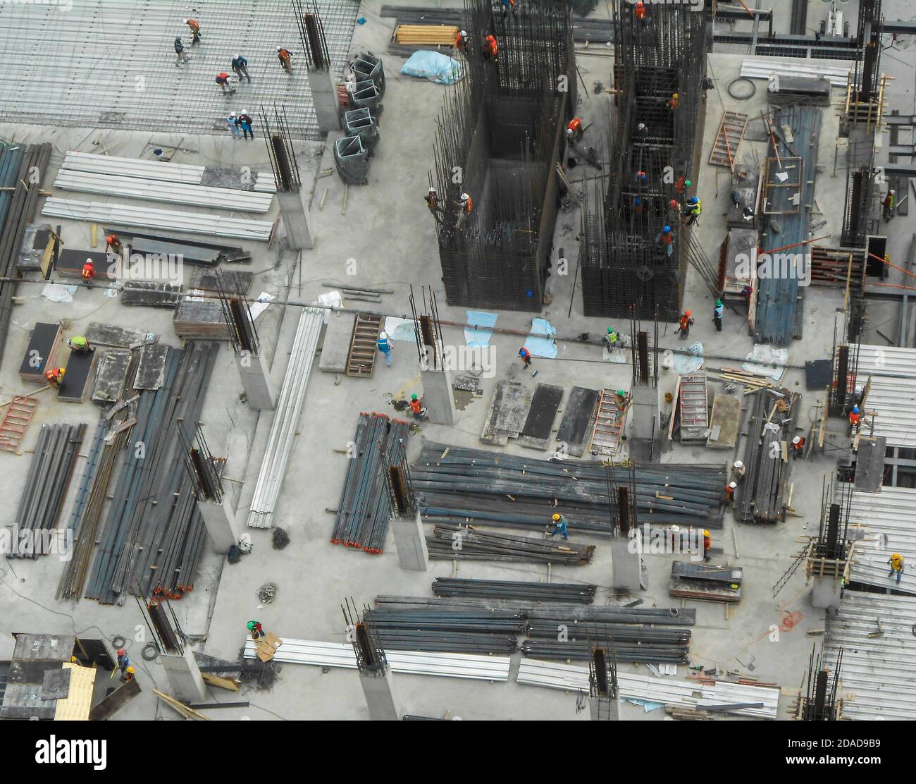 Building construction site with workers viewed from above Stock Photo