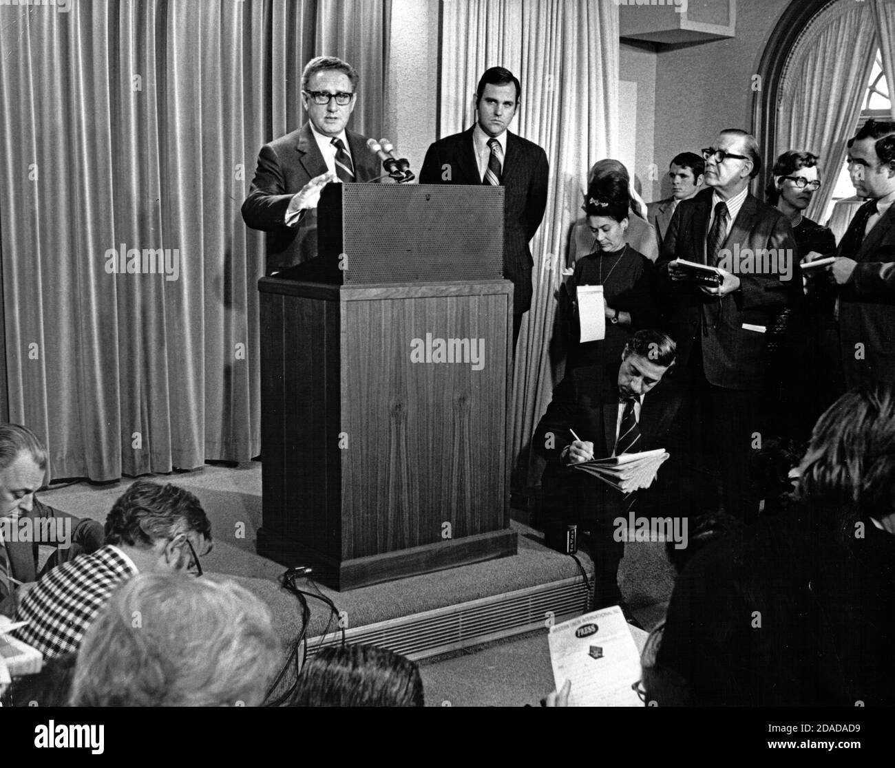 United States National Security Advisor Henry A. Kissinger briefs reporters on his trip to Beijing and Hanoi in the press briefing room of the White House in Washington, DC on February 22, 1973. Kissinger announced that two American POWs held by the Chinese since 1957 will be released and he also announced diplomatic relations would begin with China in the form of a Chinese delegation to the US. Standing at right is White House Press Secretary Ron Ziegler.Credit: Benjamin E. 'Gene' Forte/CNP | usage worldwide Stock Photo