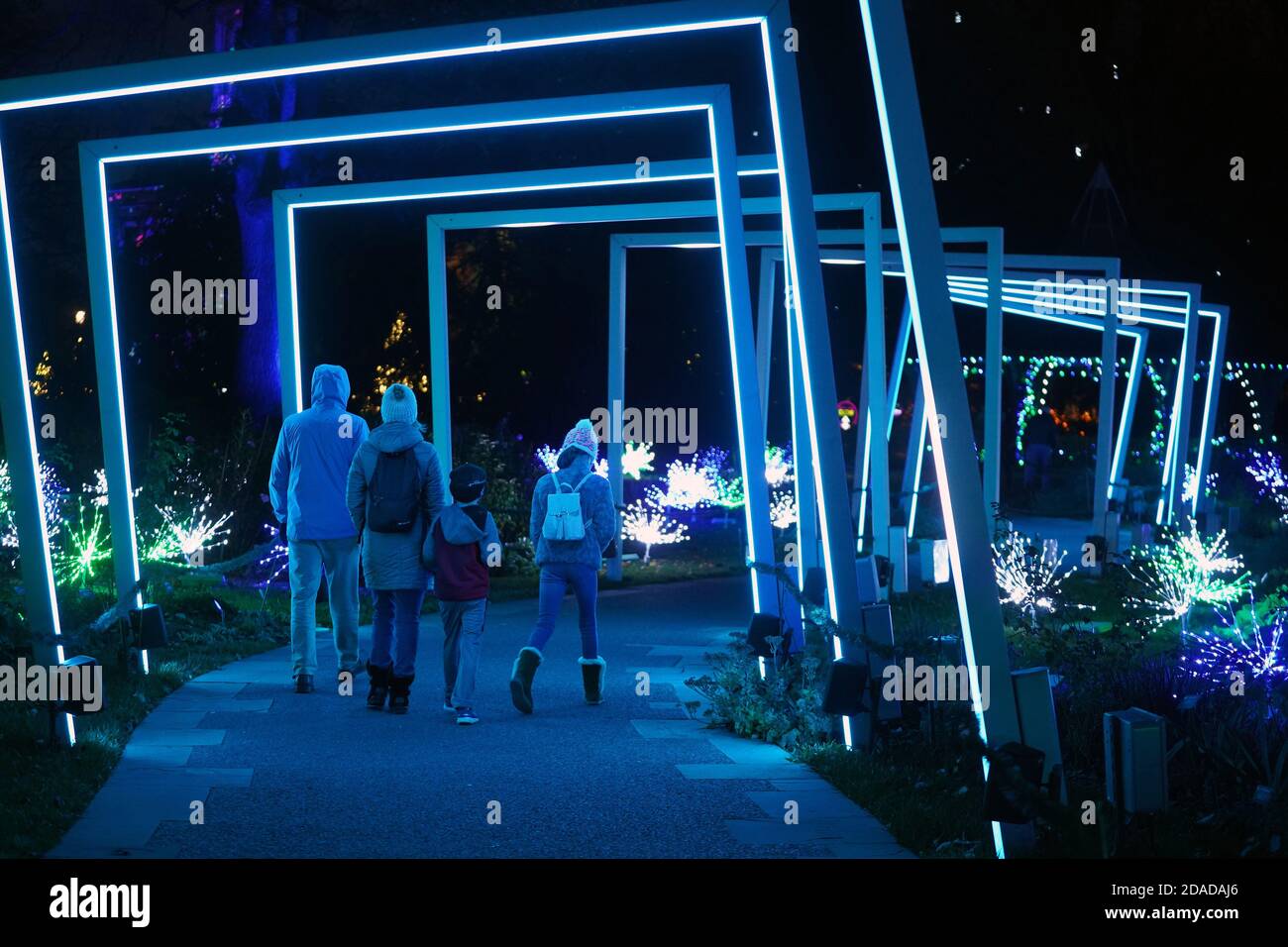St. Louis, United States. 11th Nov, 2020. A family walks through a lighted display on opening night of Garden Glow at The Missouri Botanical Garden in St. Louis on Wednesday, November 11, 2020. Photo by Bill Greenblatt/UPI Credit: UPI/Alamy Live News Stock Photo