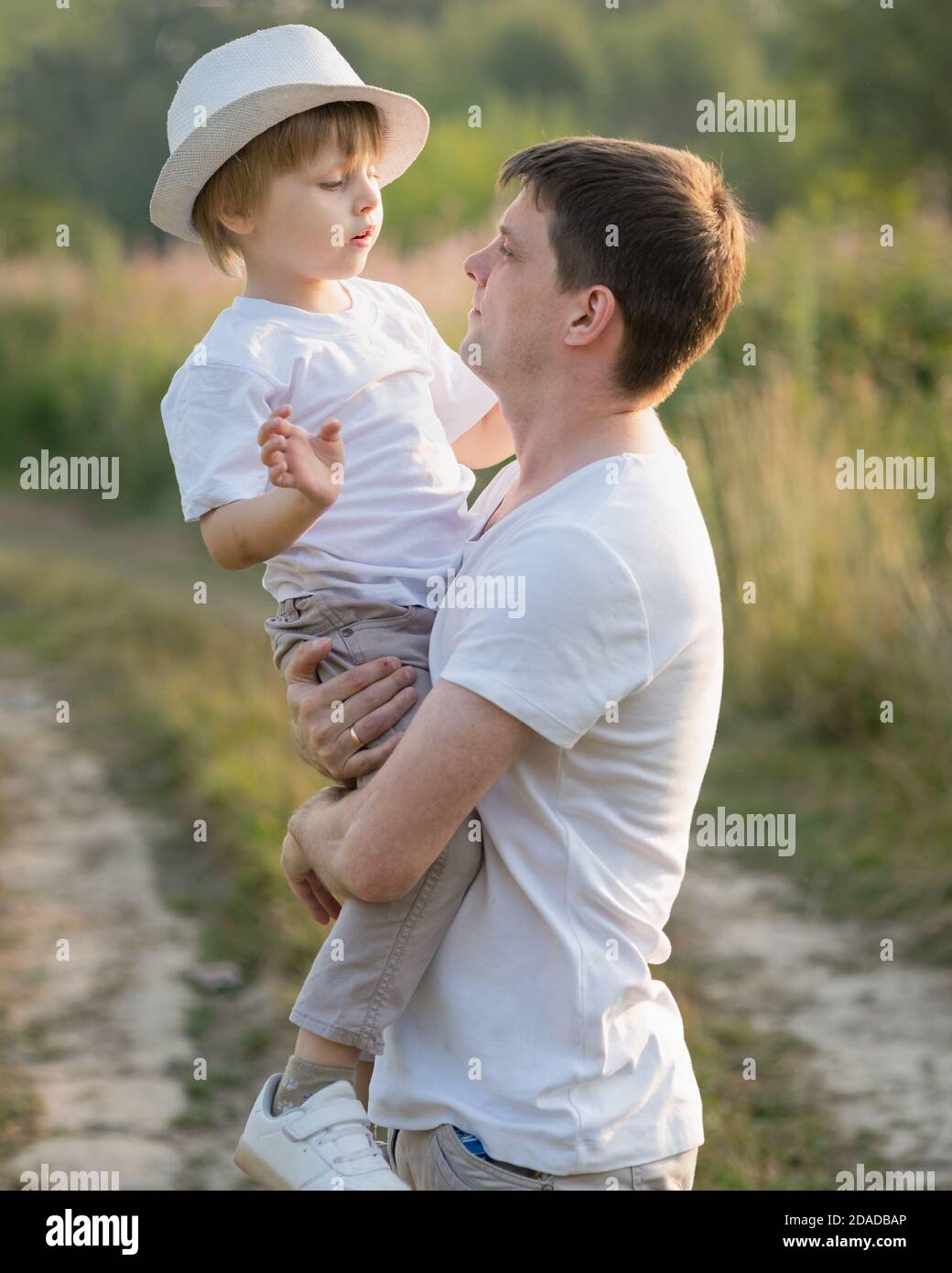 Father son hugging in tree hi-res stock photography and images - Alamy