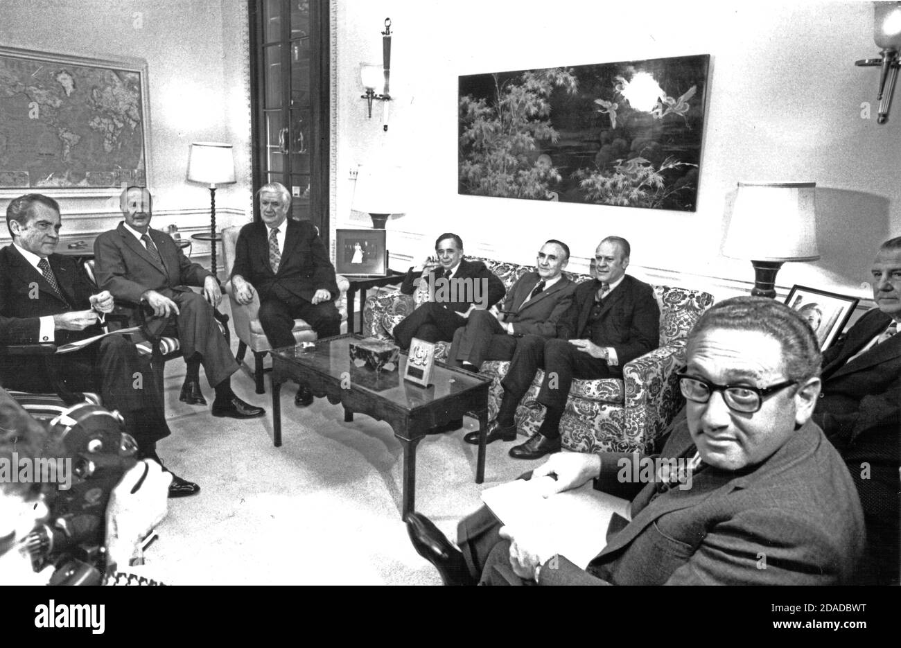In this photo released by the White House, United States President Richard M. Nixon, left, meets bipartisan US Congressional leadership prior to his televised address announcing the “conclusion of an agreement for ending the war and restoring peace in Vietnam” in the White House in Washington, DC on January 23, 1973.  From left to right: President Nixon; US Senate Minority Leader Hugh Scott (Republican of Pennsylvania); US House Majority Leader Thomas P. “Tip” O’Neill (Democrat of Massachusetts); Speaker of the US House of Representatives Carl Albert (Democrat of Oklahoma); US Senate Majority Stock Photo