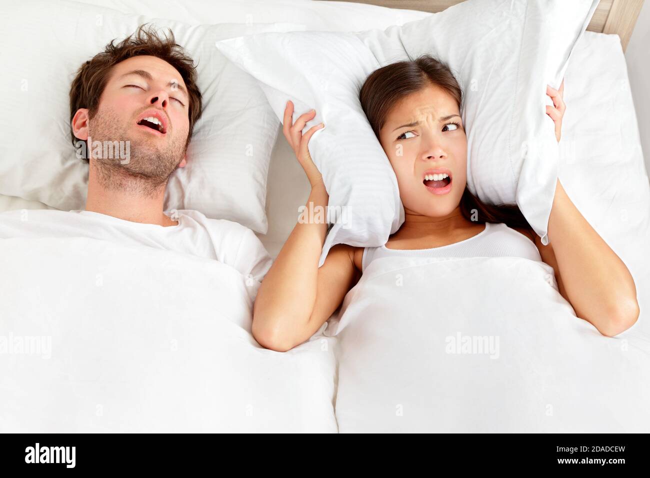 Snoring man - couple in bed Stock Photo