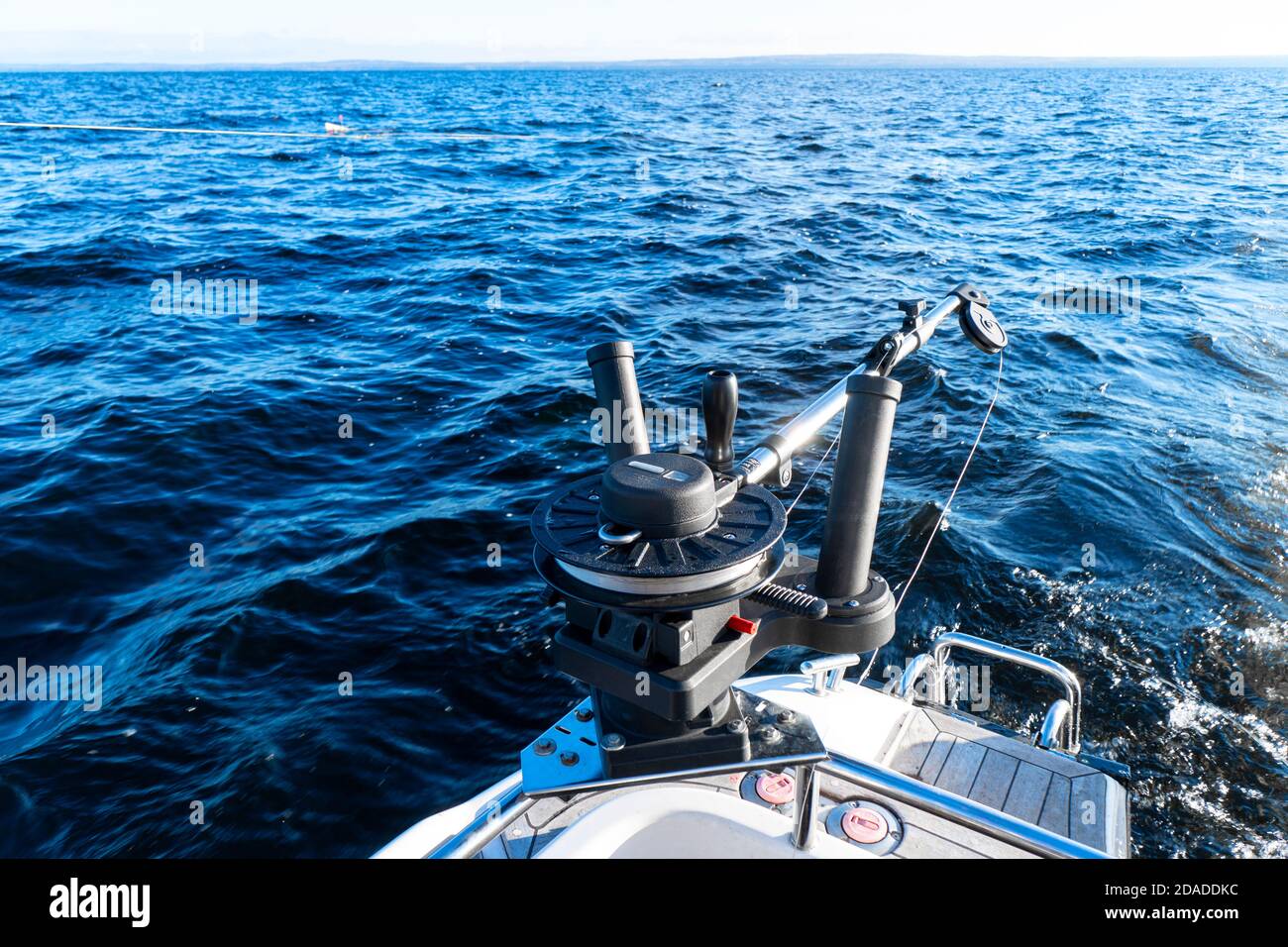 https://c8.alamy.com/comp/2DADDKC/fishing-equipment-on-boat-downrigger-boat-gear-for-trolling-fishing-boat-with-down-rigger-trolling-in-blue-ocean-fisherman-boat-in-the-sea-2DADDKC.jpg